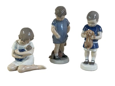 Lot 273 - ROYAL COPENHAGEN; three porcelain figures,...