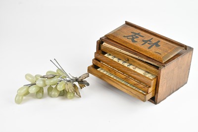 Lot 1368 - An oak cased mahjong set and a Chinese carved...