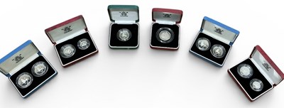 Lot 1604 - THE ROYAL MINT; six cases containing...