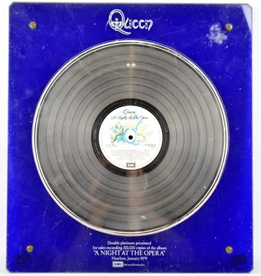 Lot 544 - QUEEN; a double platinum presented replica of...