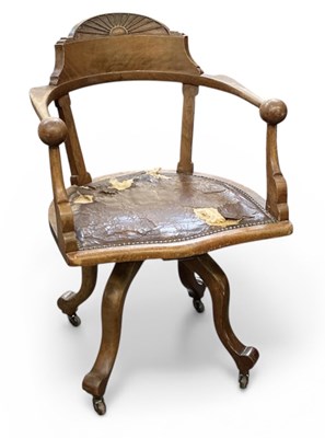 Lot 60 - An early 20th century mahogany revolving open...