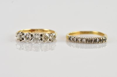 Lot 510 - A yellow metal diamond set five stone dress...