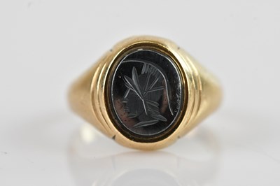 Lot 688 - A 9ct yellow gold and onyx signet ring, size Q,...