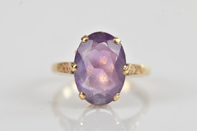 Lot 667 - A 9ct yellow gold dress ring set with an oval...