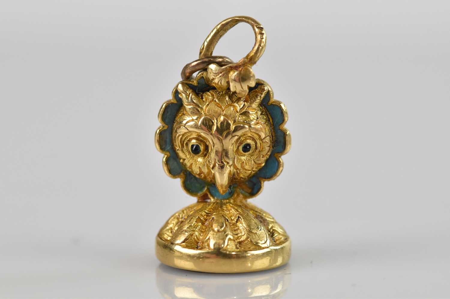 Lot 6 - A yellow metal novelty seal formed as an owl,...