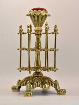 Lot 372 - An early 20th century brass thread bobbin...