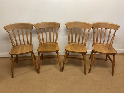 Lot 687 - A set of four beech chairs with turned legs...