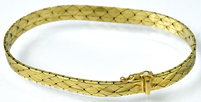 Lot 772 - A 9ct gold bracelet, flat link with bright cut...