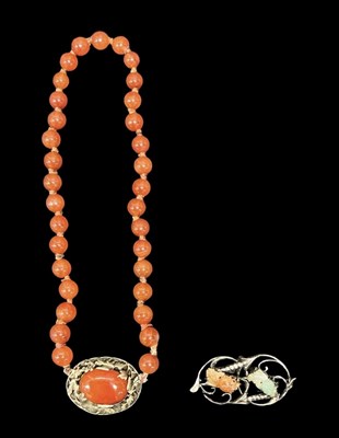 Lot 1545 - A Chinese single strand carnelian bead...
