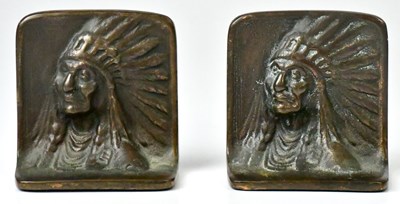 Lot 275 - A pair of bronze bookends, with cast image of...