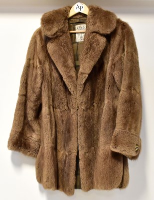 Lot 354 - A palomino mink fur stole, a musquash car coat,...