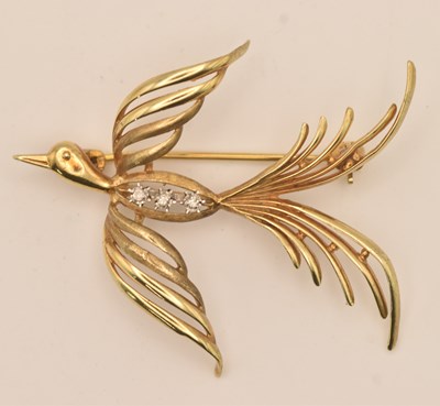 Lot 1503 - A 9ct yellow gold diamond set brooch modelled...
