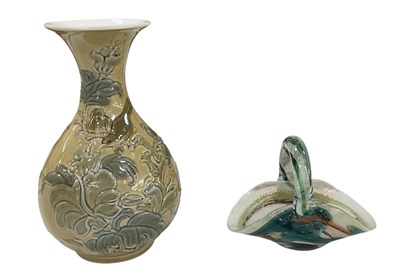 Lot 638 - LLADRÓ; a floral decorated beige ground...
