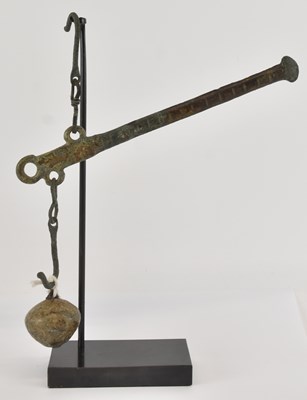 Lot 1061 - An ancient Byzantine bronze balance weighing...