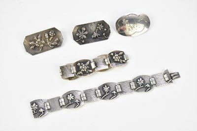 Lot 483 - J H UMLAND; two white metal bracelets...