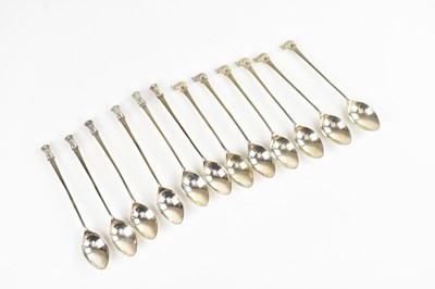 Lot 276 - A set of six plated tea spoons with elephant...