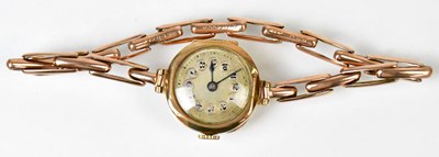 Lot 919 - REGNIA; a 9ct yellow gold cocktail watch, the...