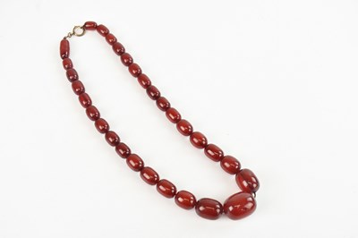 Lot 365 - A string of graduated cherry amber coloured...