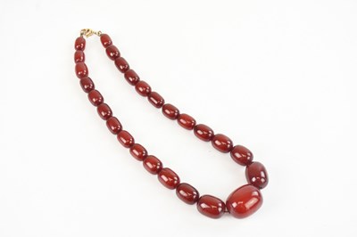 Lot 366 - A string of graduated cherry amber coloured...