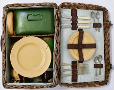 Lot 215 - An early 20th century wicker picnic basket and...