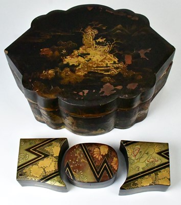 Lot 181 - A Japanese gilt-heightened black lacquered...
