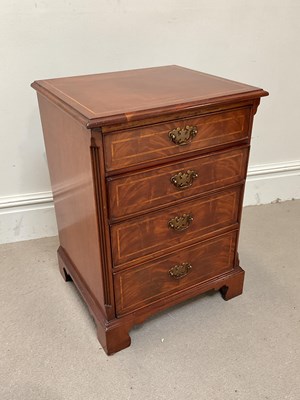Lot 110 - A reproduction mahogany pillar chest of four...