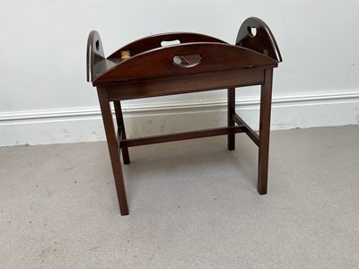 Lot 101 - A reproduction mahogany folding butler's tray...