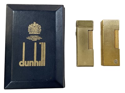 Lot 334 - DUNHILL; a cased gold plated cigarette lighter,...