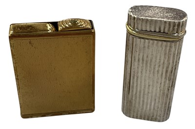 Lot 343 - CARTIER; a silvered and gold plated cigarette...
