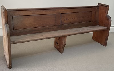 Lot 1045 - A late 19th century pitch pine pew, length 199cm.