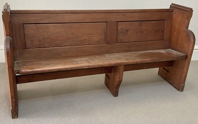 Lot 1046 - A late 19th century pitch pine pew, length 168cm.