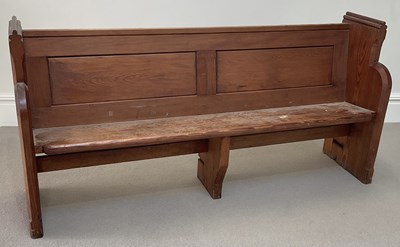 Lot 1047 - A late 19th century pitch pine pew, length 174cm.