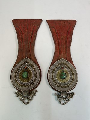 Lot 115 - A pair of Tibetan leather belt pendants...
