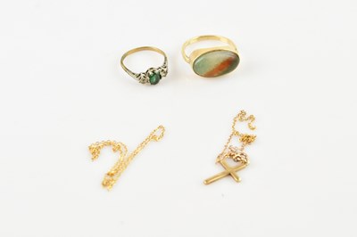 Lot 690 - A 9ct gold and hardstone cabochon ring, size 9,...