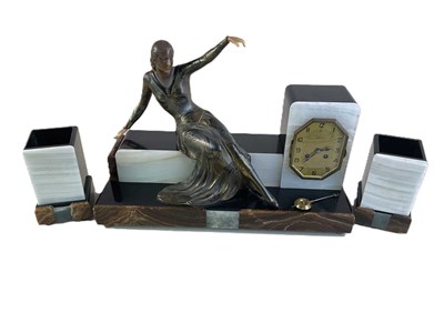 Lot 197 - A French Art Deco clock garniture, the figural...