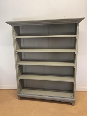 Lot 712 - A painted pine book shelf, with five shelves,...
