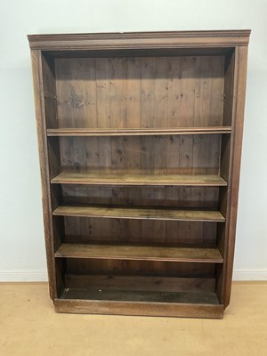 Lot 713 - A stained pine book shelf with five shelves,...