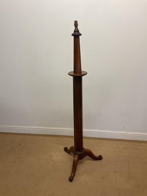 Lot 715 - A mahogany octagonal column pedestal lamp...
