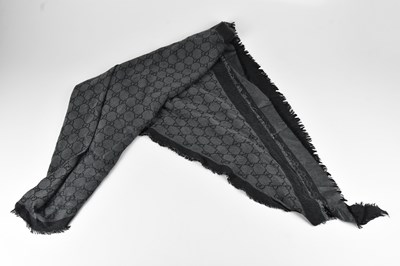 Lot 1276 - GUCCI; a 100% wool black and grey large...