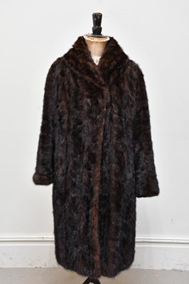 Lot 1325 - A dark brown vintage knee length mink coat...