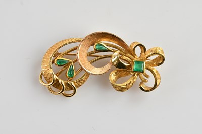 Lot 180 - A yellow metal bow brooch, set with three...