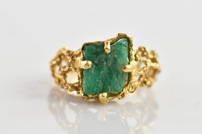 Lot 649 - A yellow metal textured ring, tests as 17.31kt...