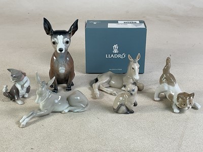 Lot 308 - LLADRO; a porcelain dog figure, height 19cm,...