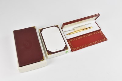 Lot 1173 - MUST DE CARTIER; a boxed yellow gold plated...