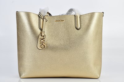 Lot 1427 - MICHAEL KORS; an unused with original tags tan...