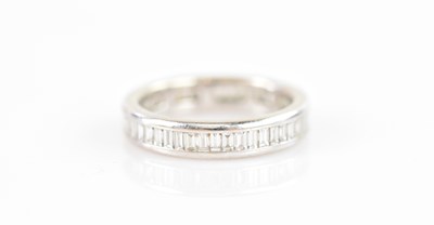 Lot 488 - An 18ct gold diamond eternity ring, set with...