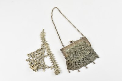 Lot 138 - A white metal mesh purse, stamped 'silver',...