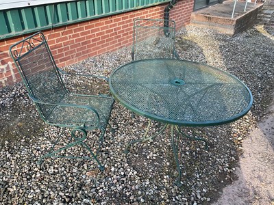 Lot 818 - A green painted metal garden table with...