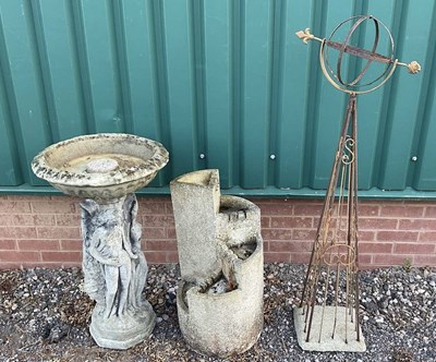 Lot 815 - A group of three garden ornaments, comprising...