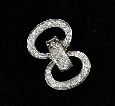 Lot 172 - A white metal diamond set twin loop clasp,...
